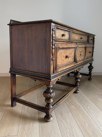 Vintage 1920s Berkey and Gay Sideboard Buffet Server Table - Jacobean Style The sideboard is supported by Baroque-style turned legs along the front with bun feet. It has a small backsplash on the backing.