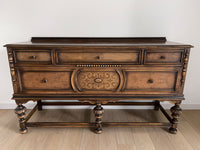 Vintage 1920s Berkey and Gay Sideboard Buffet Server Table - Jacobean Style The sideboard is supported by Baroque-style turned legs along the front with bun feet. It has a small backsplash on the backing.