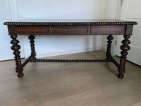 Vintage Portuguese Inspired Wood Barley Twist Writing Desk or Center Table An exceptional monumental Portuguese 1900s inspired barley twist writing desk, console, sofa or center table believed to be from the late 20th century or post 1960s to 1990s. There is not a tag or stamp. Baroque or Jacobean revival style with three smooth sliding drawers. The drawer has a pen holder in the center drawer.