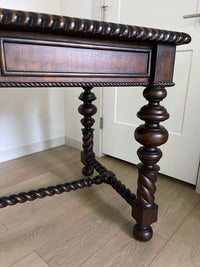 Vintage Portuguese Inspired Wood Barley Twist Writing Desk or Center Table An exceptional monumental Portuguese 1900s inspired barley twist writing desk, console, sofa or center table believed to be from the late 20th century or post 1960s to 1990s. There is not a tag or stamp. Baroque or Jacobean revival style with three smooth sliding drawers. The drawer has a pen holder in the center drawer.