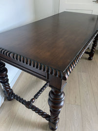 Vintage Portuguese Inspired Wood Barley Twist Writing Desk or Center Table An exceptional monumental Portuguese 1900s inspired barley twist writing desk, console, sofa or center table believed to be from the late 20th century or post 1960s to 1990s. There is not a tag or stamp. Baroque or Jacobean revival style with three smooth sliding drawers. The drawer has a pen holder in the center drawer.