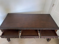 Vintage Portuguese Inspired Wood Barley Twist Writing Desk or Center Table An exceptional monumental Portuguese 1900s inspired barley twist writing desk, console, sofa or center table believed to be from the late 20th century or post 1960s to 1990s. There is not a tag or stamp. Baroque or Jacobean revival style with three smooth sliding drawers. The drawer has a pen holder in the center drawer.
