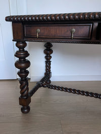 Vintage Portuguese Inspired Wood Barley Twist Writing Desk or Center Table An exceptional monumental Portuguese 1900s inspired barley twist writing desk, console, sofa or center table believed to be from the late 20th century or post 1960s to 1990s. There is not a tag or stamp. Baroque or Jacobean revival style with three smooth sliding drawers. The drawer has a pen holder in the center drawer.