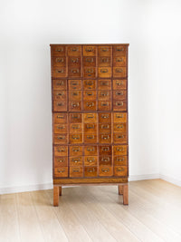 Antique 1900s Yawman Erbe 60 Drawer Library Card Catalog - Quarter Sawn Tiger Oak Industrial Stacking Architectural Cabinet YAWMAN AND ERBE MFG. CO. Rochester, N.Y. U.S.A. file cabinet. c1900s. This rare and beautiful quarter sawn tiger oak card catalog, apothecary, haberdashery or architectural cabinet storage piece would make a perfect statement piece for your bar, wine storage, entryway, foyer, dining room, office or commercial space!