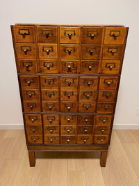 Antique 1900s Yawman Erbe 60 Drawer Library Card Catalog - Quarter Sawn Tiger Oak Industrial Stacking Architectural Cabinet YAWMAN AND ERBE MFG. CO. Rochester, N.Y. U.S.A. file cabinet. c1900s. This rare and beautiful quarter sawn tiger oak card catalog, apothecary, haberdashery or architectural cabinet storage piece would make a perfect statement piece for your bar, wine storage, entryway, foyer, dining room, office or commercial space!