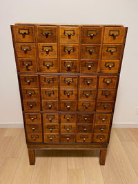 Antique 1900s Yawman Erbe 60 Drawer Library Card Catalog - Quarter Sawn Tiger Oak Industrial Stacking Architectural Cabinet  YAWMAN AND ERBE MFG. CO. Rochester, N.Y. U.S.A. file cabinet. c1900s.  This rare and beautiful quarter sawn tiger oak card catalog, apothecary, haberdashery or architectural cabinet storage piece would make a perfect statement piece for your bar, wine storage, entryway, foyer, dining room, office or commercial space! 