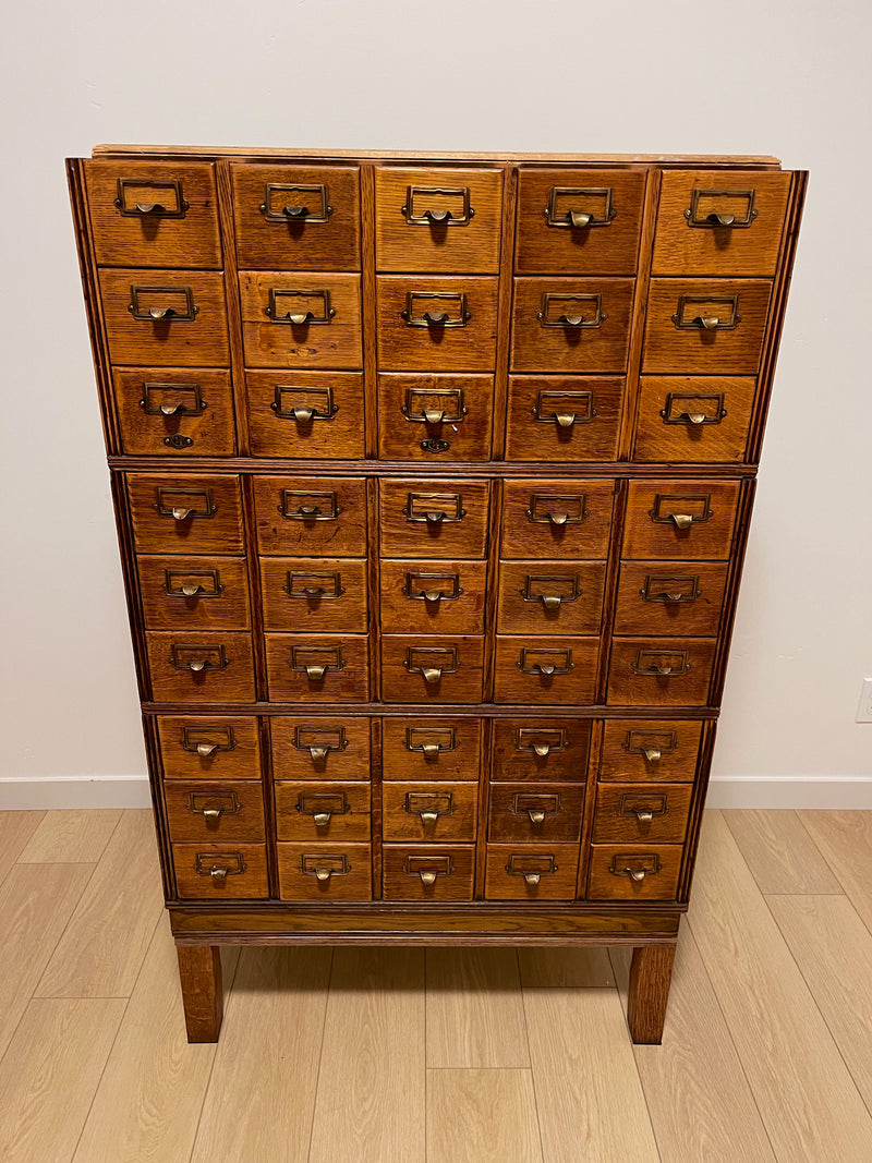 Antique 1900s Yawman Erbe 60 Drawer Library Card Catalog - Quarter Sawn Tiger Oak Industrial Stacking Architectural Cabinet  YAWMAN AND ERBE MFG. CO. Rochester, N.Y. U.S.A. file cabinet. c1900s.  This rare and beautiful quarter sawn tiger oak card catalog, apothecary, haberdashery or architectural cabinet storage piece would make a perfect statement piece for your bar, wine storage, entryway, foyer, dining room, office or commercial space! 