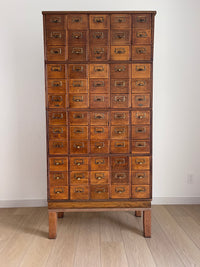 Antique 1900s Yawman Erbe 60 Drawer Library Card Catalog - Quarter Sawn Tiger Oak Industrial Stacking Architectural Cabinet YAWMAN AND ERBE MFG. CO. Rochester, N.Y. U.S.A. file cabinet. c1900s. This rare and beautiful quarter sawn tiger oak card catalog, apothecary, haberdashery or architectural cabinet storage piece would make a perfect statement piece for your bar, wine storage, entryway, foyer, dining room, office or commercial space!