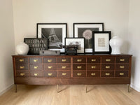 Antique 9 Foot, Mahogany Credenza Lateral 24 Drawer Haberdashery Solid Wood Cabinet - Circa 1920s. A versatile large scale cabinet ideally suited in a retail environment, hotel, library, bourbon bar, an oversized sofa table or office space.