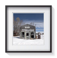 An abandoned petrol filling station in Daniel, Wyoming during a heavy snow winter. Framed fine art shack and rustic photography by Andrew Grant.  Framed wall art for your home, office, business, restaurant, bar, vacation house or hotel.