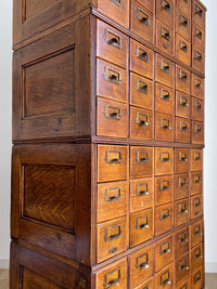 Antique 1900s Yawman Erbe 60 Drawer Library Card Catalog - Quarter Sawn Tiger Oak Industrial Stacking Architectural Cabinet YAWMAN AND ERBE MFG. CO. Rochester, N.Y. U.S.A. file cabinet. c1900s. This rare and beautiful quarter sawn tiger oak card catalog, apothecary, haberdashery or architectural cabinet storage piece would make a perfect statement piece for your bar, wine storage, entryway, foyer, dining room, office or commercial space!
