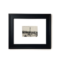 1900s Paris La Place de la Bastille - Vintage France Framed Art  A real black and white photo of the Bastille in Paris, France with people walking all around it.