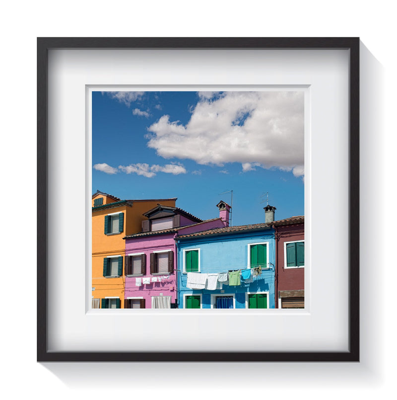 The vibrant colors of the homes and laundry in Burano, Italy. Framed fine art architecture and Europe photography Andrew Grant.  Framed wall art for your home, office, business, restaurant, bar, vacation house or hotel.