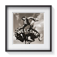 A bucking bronco and cowboy welcome sign in Jackson Hole, Wyoming. Fine art Americana and Rustic photography by Amanda Hedlund.  Framed wall art for your home, office, business, restaurant, bar, vacation house or hotel.