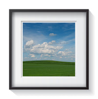 Rolling green hills with blue skies in Iowa. Framed fine art landscape photography by Andrew Grant.  Framed wall art for your home, office, business, restaurant, bar, vacation house or hotel.
