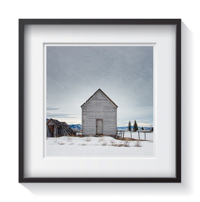 An old grey shack fading away in the cloudy skies of winter. Framed fine art shack and rustic photography by Amanda Hedlund.  Framed wall art for your home, office, business, restaurant, bar, vacation house or hotel.