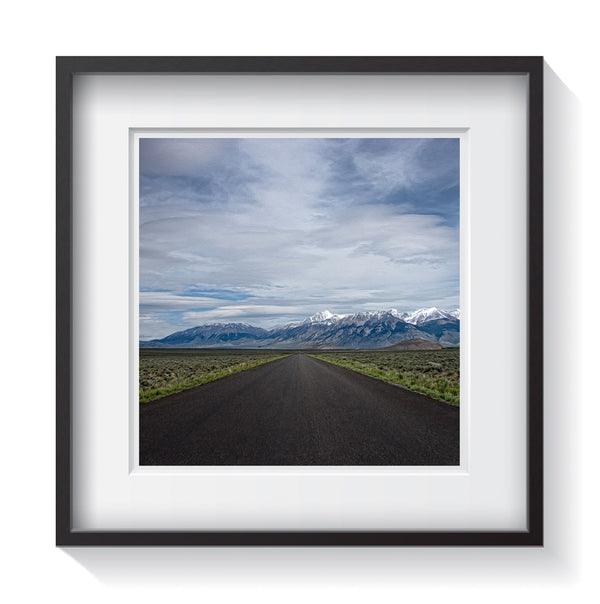 An open range road through the mountainous fields of Idaho. Framed fine art landscape photography by Amanda Hedlund.   Framed wall art for your home, office, business, restaurant, bar, vacation house or hotel.