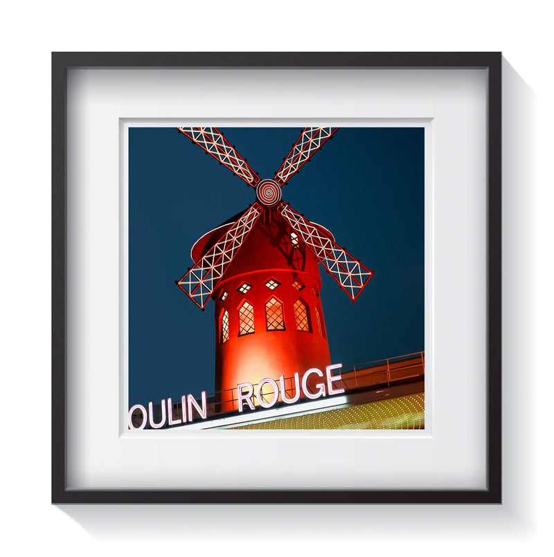 The Moulin Rouge iconic red windmill in Paris, France at dusk. Framed fine art street art photography by Andrew Grant.  Framed wall art for your home, office, business, restaurant, bar, vacation house or hotel.