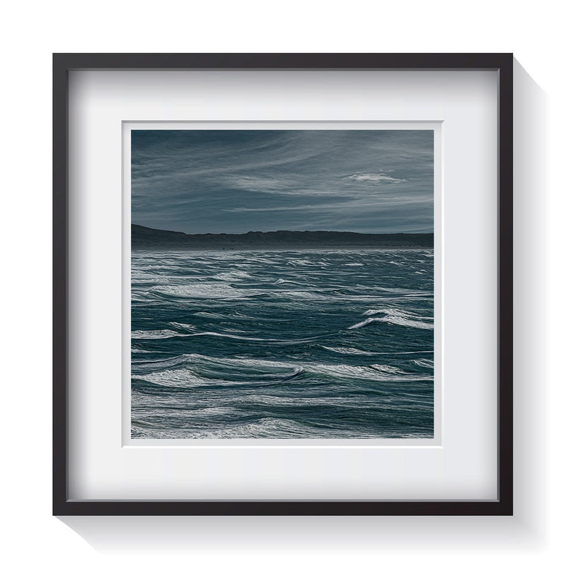The rich blue colors from a choppy sea along the Pacific Coast Highway in northern California. Waterscape photography by Andrew Grant.  Framed wall art for your home, office, business, restaurant, bar, vacation house or hotel.