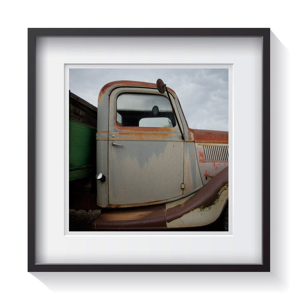 An old grey and patina rust curvy pickup truck in Santa Fe, New Mexico. Framed fine art classic truck photography by Andrew Grant.  Framed wall art for your home, office, business, restaurant, bar, vacation house or hotel.