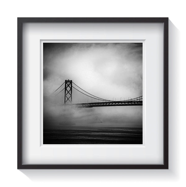 The Bay Bridge hiding amongst the fog in San Fransisco bay area. Fine art bridge photography by Amanda Hedlund.  Framed wall art for your home, office, business, restaurant, bar, vacation house or hotel.