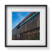 An old vintage Baltimore Railroad train car with solid industrial metals and faded patina paint. Framed fine art industrial photography by Andrew Grant.  Framed wall art for your home, office, business, restaurant, bar, vacation house or hotel.