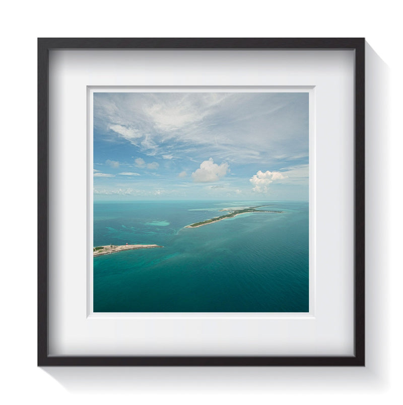 Aerial view of the island and tropical seas of Cat Key, Bahamas. Framed fine art waterscape photography by Andrew Grant.  Framed wall art for your home, office, business, restaurant, bar, vacation house or hotel.